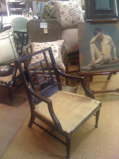 This is the antique lattice back chair that he based his new chairs and benches on.  Behind it is a Danish Academic Nude Study by artist Carl B Moller.