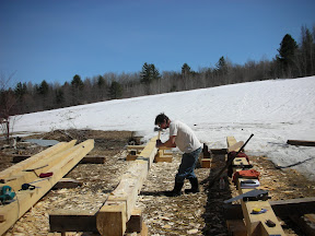 Seth Kelley scores one of the new plate timbers before surfacing with a broad axe.