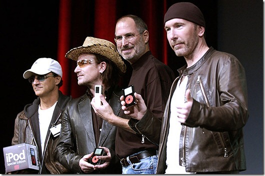 SAN JOSE, CA - OCTOBER 26:  Steve Jobs (2nd-R) of Apple Computer poses with Interscope Geffen A&M Records Chairman Jimmy Iovine (L) Bono (2nd-L) and The Edge (R) of U2 at a celebration of the release of a new Apple iPod family of products at the California Theatre on October 26, 2004 in San Jose, California.  (Photo by Tim Mosenfelder/Getty Images)
