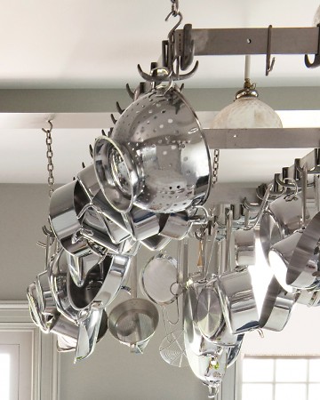 Pots and pans can take up a lot of space on your counters and in your cabinets. Remedy that with a pot hanger like this one in Martha's kitchen. Pots and pans can take up a lot of space on your counters and in your cabinets. Remedy that with a pot hanger like this one in Martha's kitchen.