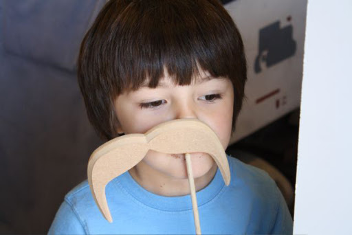 We designed a variety of moustaches to be used as props for the photo booth -- inspired by the moustaches that were used in the cracker pull favors.