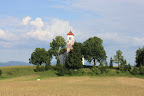 The church in Zelše near cerknica. It is built on a small hill to the south of the village and is dedicated to Saint Volbenk and belongs to the Cerknica Parish. It was built around 1680 with a triple rounded apse, unique in the region. The belfry was added in the 18th century. It has excellent acoustics and is sometimes used as a venue for various concerts.