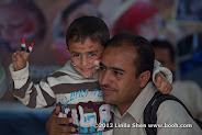 AFP photographer Mohammed Huwais and his son Abdullah. The Change Square, Sana'a, Yemen.  ساحة التغيير بصنعاء اليمن