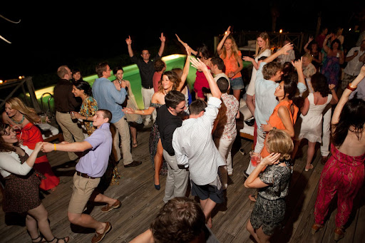 Guests danced by the pool to music played by DJ Dave Meek of No Static. Later in the evening, he spun old-school rock 'n' roll to which Vanessa's parents, Candice and Bobby, performed an impromptu routine. Guests danced by the pool to music played by DJ Dave Meek of No Static. Later in the evening, he spun old-school rock 'n' roll to which Vanessa's parents, Candice and Bobby, performed an impromptu routine.
