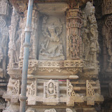 Chamunda? shown with twelve hands, all are broken now. A demon shown lying at the base, while a boar is standing over it. This is a strange iconography as I have not see a boar till now in Chamuda images. There is snake waist band around the waist on this inage, so could it be Shiva, however the breasts seems to be quite prominent as though in the image.