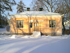Old cottage house in winter