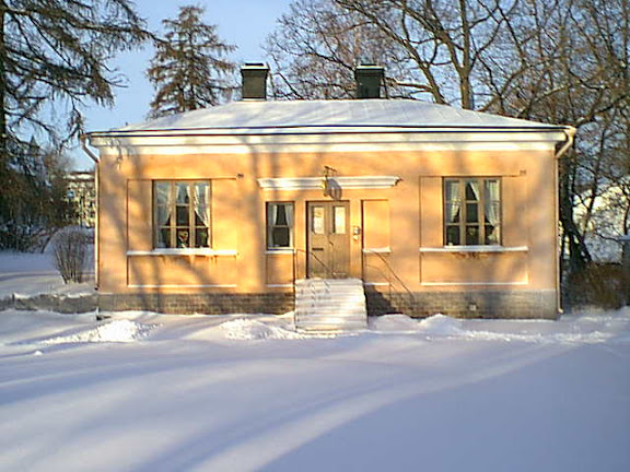 Old cottage house in winter