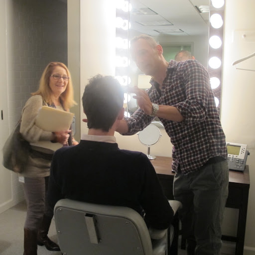 My hair stylist Anthony Sorensen coifs my 'do, while Producer Barbara Fight makes sure he doesn't miss any stray hairs. Getting ready for TV can be so laborious!