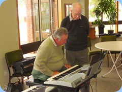 Ken Mahy preparing to play Peter Brophy's Yamaha PSR-910 keyboard.