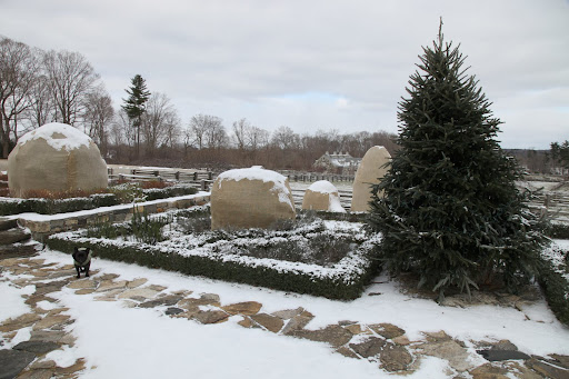 It means that all of the workers better hurry up and finish decorating for the holidays!  For example, this tree is just one of many that needs to be adorned.