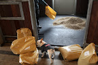 According to the instructions on the sack, for a 12 x 12 foot stall you only need 6 bags to get started.