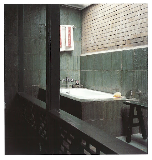 I love the mysterious feel of this Asian-influenced bathroom - it is both polished and raw.