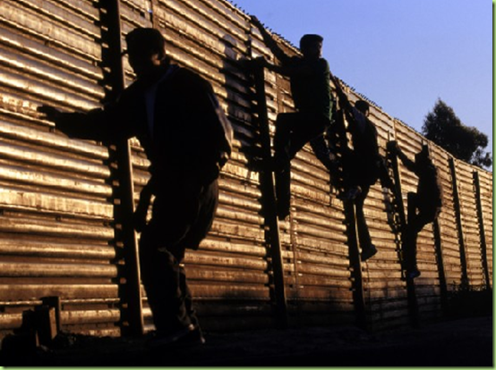 immigrants-fence-climbing