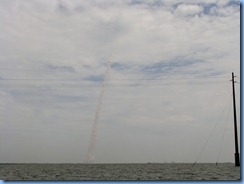 7979 private boat charter with Capt. Ron Presley  and his wife Karen - Banana River, Florida - Kennedy Space Center - Atlantis disappears into the clouds