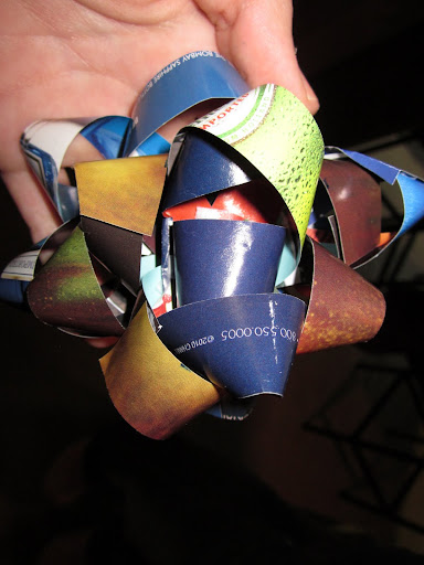 Turning a page of a magazine into a gift bow is easy once you get the hang of it. You just need to hang a little to get it right. This was my second bow. Turning a page of a magazine into a gift bow is easy once you get the hang of it. You just need to hang a little to get it right. This was my second bow.