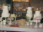 We combined ideas from the current issue of MSW with the wonderful product from BHLDN. Cakes from ChocolateGourment.com were designed to match some of the dresses. And the gorgeous flowers are from ExquisiteDesigns.com.