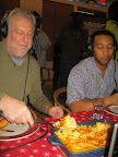 Jonathan helping himself to some of John's mac and cheese.
