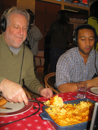 Jonathan helping himself to some of John's mac and cheese.