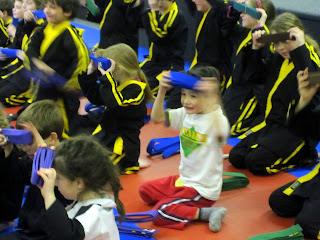Eidan, wiping sweat on his new belt