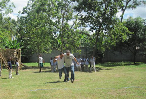 Pat and Johan demonstrating how to run with their legs tied together.