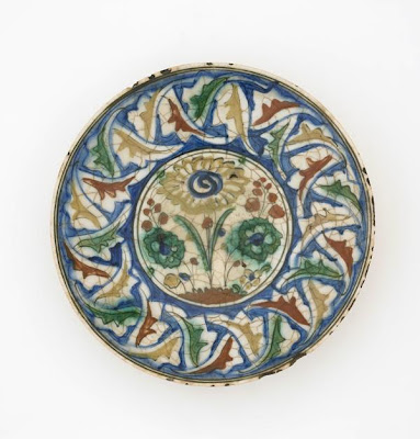 Plate | Origin:  Iran | Period: late 16th-early 17th century  Safavid period | Details:  Not Available | Type: Stone-paste painted under colorless glaze | Size: W: 8.4  cm | Museum Code: S1997.56 | Photograph and description taken from Freer and the Sackler (Smithsonian) Museums.