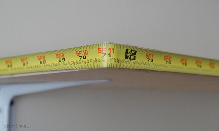 Use busted tape measures to decorate shelves - choosetothrive.blogspot.com