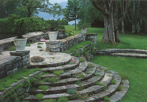 My heart aches looking at this lovely photo of circular steps and terrace plantings.