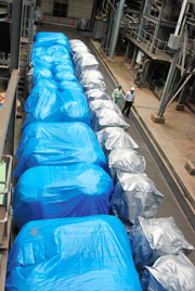 Bags of incineration ash are piled up on the passageway of a sewage treatment facility in Kawasaki. Mikio Kano / Asahi Shimbun