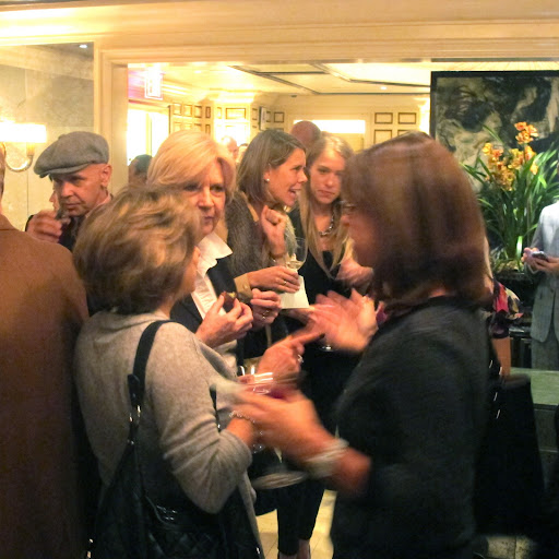 Guests mingle and talk in the restaurant.
