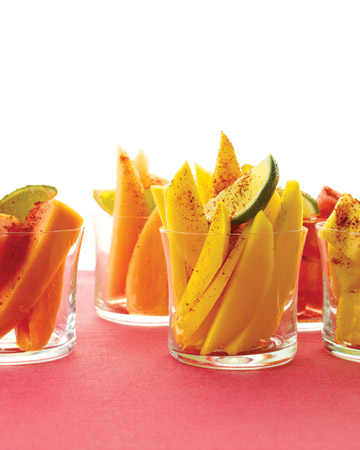 A sprinkle of chili brightens the sweet flavor of sliced mangoes. (marthastewart.com)