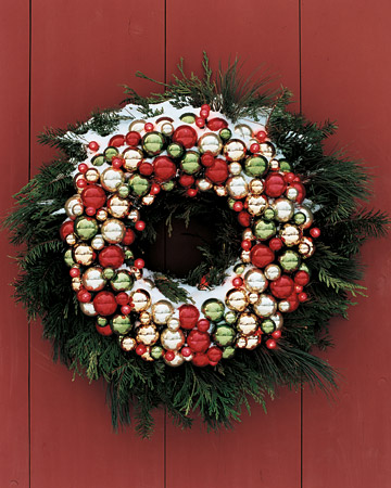 Make the entrance to your home inviting to holiday visitors -- including Santa -- with bright, merry lights; their sparkle highlights the shimmering globes and greenery of this double wreath. Make the entrance to your home inviting to holiday visitors -- including Santa -- with bright, merry lights; their sparkle highlights the shimmering globes and greenery of this double wreath.