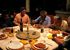 Dinner during a rainstorm with men from the city.