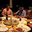 Dinner during a rainstorm with men from the city.