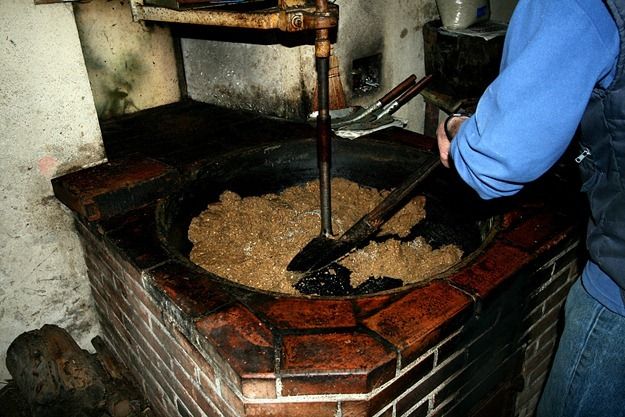 Walnut oil maker stirring Walnut oil maker stirring