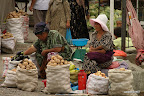 Women selling potatoes and vegetables