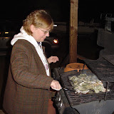 Cindy is grilling some oysters.
