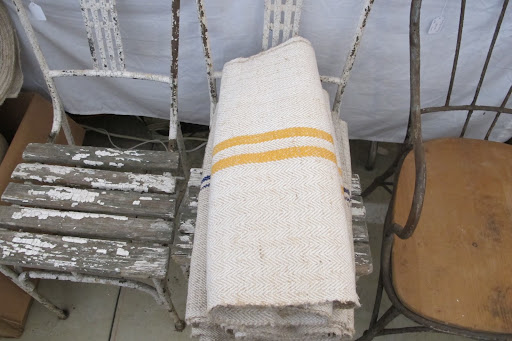 This trio of antique chairs was lovely. This mustard stripe stood out among the mostly blue and red striped linens.
