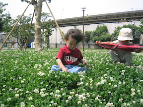 Eidan in the grass at the World City Tower's park