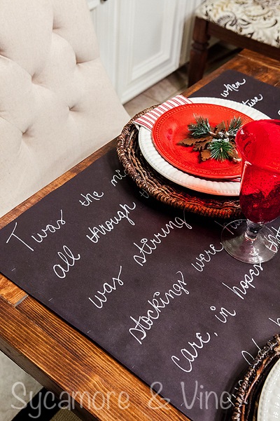 Twas the night before Christmas Chalkboard table runner for dining room. A truly stunning Christmas Home Tour as part of the Christmas in the Country Blog Tour. This Plaid Inspired Country Christmas will knock your socks off. Features tours of the Living room, Dining Room and a Cocoa hot chocolate bar in the Breakfast room. There is so much inspiration for Christmas decorations in this one post. Be prepared to feel like you are cuddled up by the fire in a warm Northwoods comfy cottage! #country #Christmas #Plaid #Holiday decorating #Holiday ideas #Holidays #Christmas decor #Holiday decor Twas the night before Christmas Chalkboard table runner for dining room. A truly stunning Christmas Home Tour as part of the Christmas in the Country Blog Tour. This Plaid Inspired Country Christmas will knock your socks off. Features tours of the Living room, Dining Room and a Cocoa hot chocolate bar in the Breakfast room. There is so much inspiration for Christmas decorations in this one post. Be prepared to feel like you are cuddled up by the fire in a warm Northwoods comfy cottage! #country #Christmas #Plaid #Holiday decorating #Holiday ideas #Holidays #Christmas decor #Holiday decor
