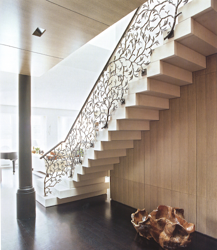 This staircase features an artfully-designed cast-bronze railing. Artist Bill Sullivan contributed to the design. This staircase features an artfully-designed cast-bronze railing. Artist Bill Sullivan contributed to the design.