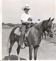 Dave Crone of Washington was active in the Horse project area during his 8 years in the Washington Hustlers.  He was successful at even a young age winning halter horse his first year.  Here he posses with ribbons from a pleasure class in 1979.  Crone now lives on his home farm where his two children are also active in 4-H.  Crone serves on the Youth Committee as well.  Photo Courtesy:  Washington County Extension.