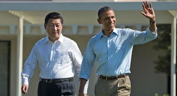 President Barack Obama (right) walks with Chinese President Xi Jinping at the Sunnylands estate on 8 June 2013 in Rancho Mirage, California. During their staged walk for the press, Obama told reporters his meetings with Xi have been 'terrific.' The issue of cyber espionage hangs over the summit, although both leaders carefully avoided accusing each other of the practice. Photo: AP Photo