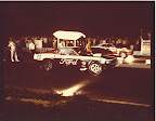 Sam Auxier, Sr. Behind Car