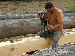 Seth drills out mortises for the stub tenons.