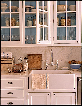 Painting the inside of glass front cabinets is another a great way to add color to a room. In this kitchen, the blue background highlights the contents of the cabinets. Painting the inside of glass front cabinets is another a great way to add color to a room. In this kitchen, the blue background highlights the contents of the cabinets.