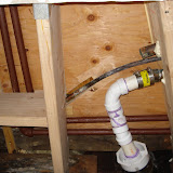 New framing in place, as seen from below. Working around all the old pipes was a challenge.