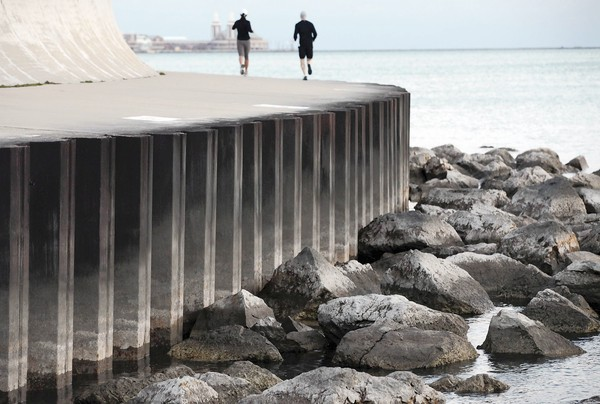 As Lake Michigan's water levels have droppedduring summer 2012, more than recreational fishers have taken note. Near the Shedd Aquarium, submerged rocks have already surfaced — new fixtures along the widening shores. Heather Charles / Chicago Tribune