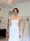 Look at this beauty! It features crystal-embroidered tulle draped over laundered charmeuse.