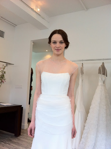 Look at this beauty! It features crystal-embroidered tulle draped over laundered charmeuse.