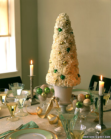 Using carnations to evoke a snow-covered tree, this centerpiece transforms the tabletop into a fanciful winter garden. Using carnations to evoke a snow-covered tree, this centerpiece transforms the tabletop into a fanciful winter garden.